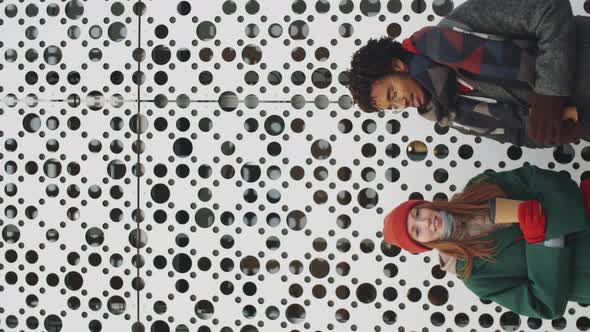 Portrait of Two Multiethnic Friends Outdoors on Winter Day