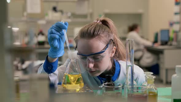 Portrait of Woman Scientist Is Researching Cure for Virus in Pharmaceutical Laboratory Spbas.