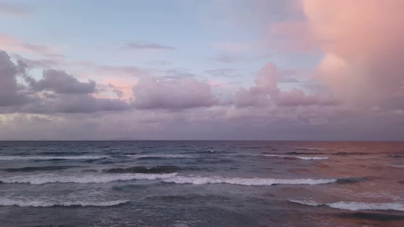 Sunset sea waves crashing on seashore