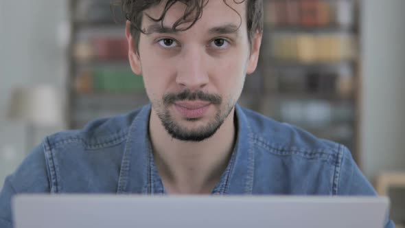 No By Casual Young Man While Rejecting Idea By Shaking Head