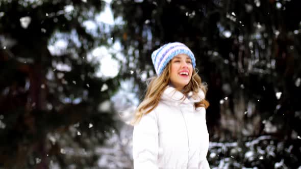 Happy Smiling Woman Outdoors in Winter Forest