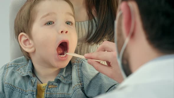 Little Boy Having Throat Examination