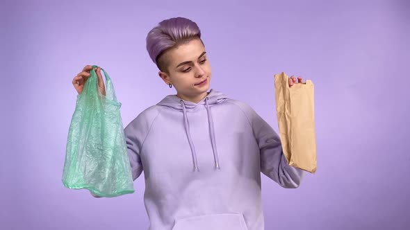 Young Adult Person Choosing Plastic or Paper Pack Isolated Indoors