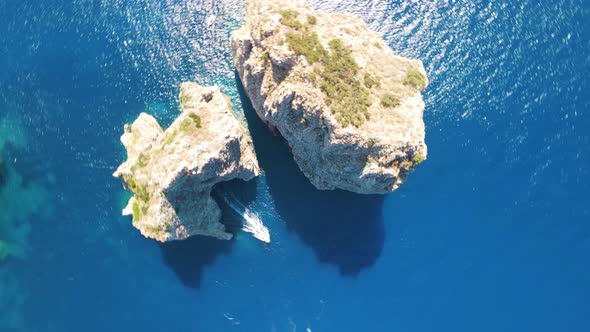 Amazing Aerial View of Faraglioni Rocks Over the Sea in Capri Island Italy