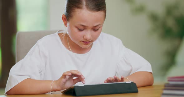 Closeup Focused Teen Girl at the Desk is Writing on Tablet First Plan and Backgroung are Blurred alt