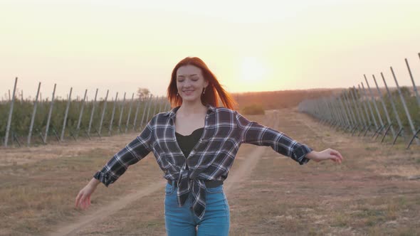 Redhead Woman Poses at Sunset