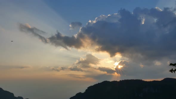 Sunrise through the sky Over Mountain