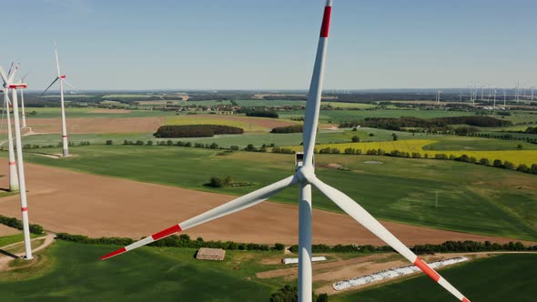 A Drone Shot of a Massive Wind Farm in Agricultural Land