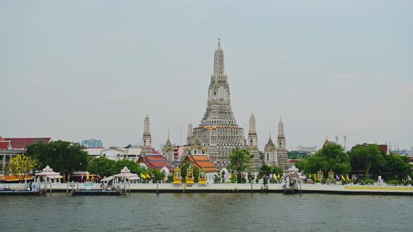 Wat Arun and Chao Phraya River in Bangkok, Thailand, a City Skyline Cityscape of Famous Buddhist Tem