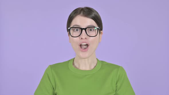 Young Woman Celebrating with Both Fest on Pink Background