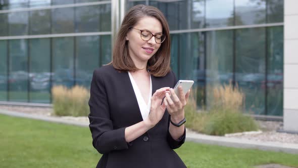 Content Business Woman Texting on Smartphone During Break