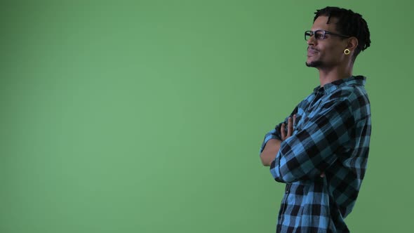 Profile View of Happy Young African Hipster Man Pointing Finger