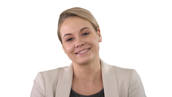 Happy young woman in formal clothes looking at camera with