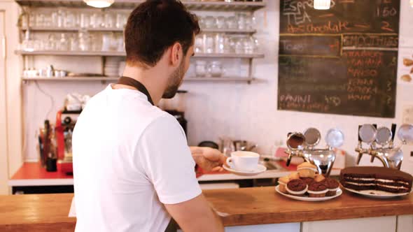 Waiter cleaning the counter