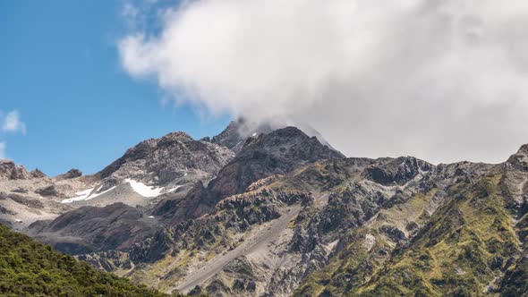 Clouds over Alpine Mountain Peak in New Zealand