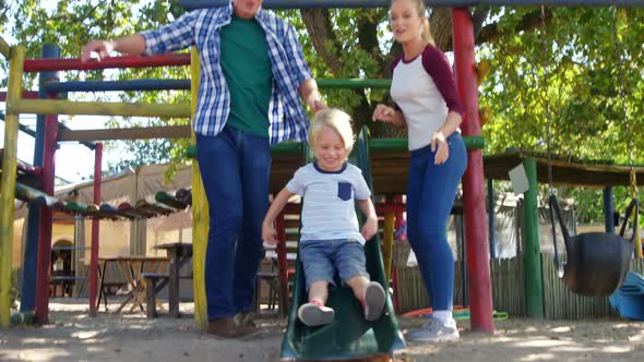 Family playing in the playground 4k