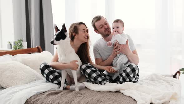 Family with Dog in the Bed