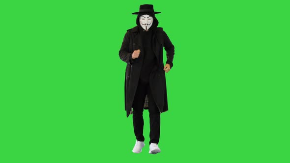 Masked Guy Fawkes Anonymous Running on a Green Screen Chroma Key