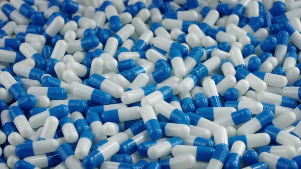 Blue And White Capsules Pile Rotating