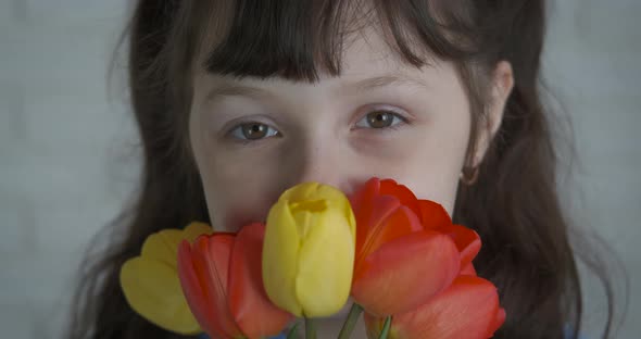 Child with tulips.