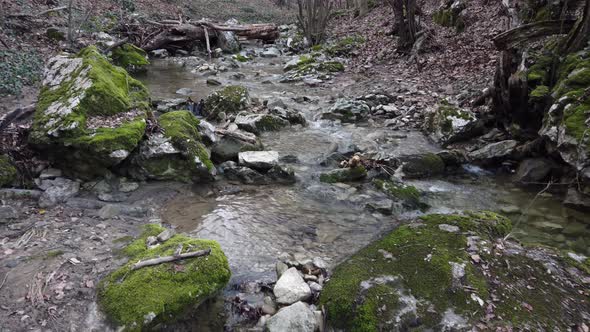 River waterfall stream rocks flow. Mountain river. River creek stream.