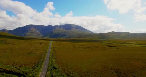 Empty road passing through grassland 4k