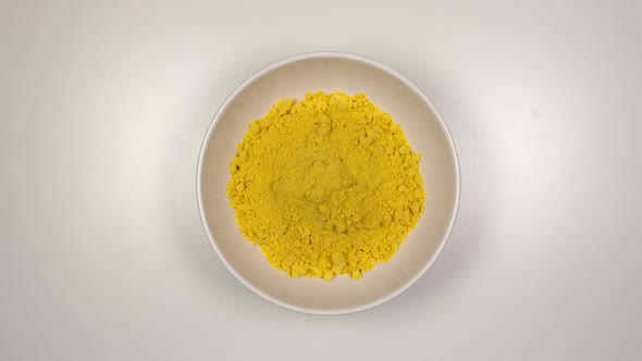 Curcuma powder fill a white dish