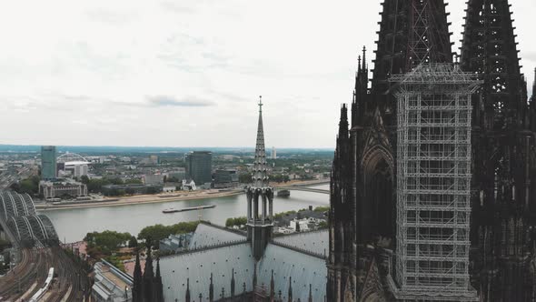 4k Aerial footage pan out of the Cologne Cathedral revealing the landscape of Cologne, Germany