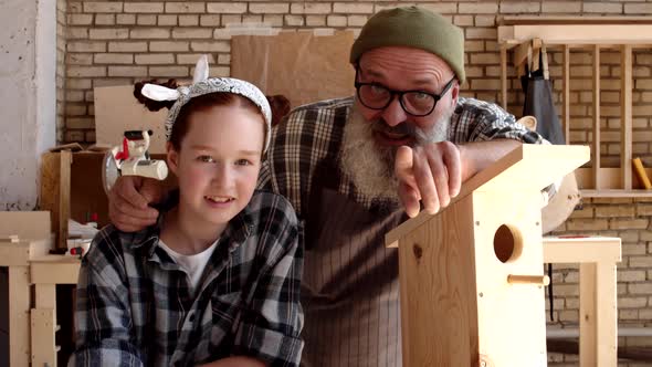 Caucasian Girl and Senior Man in Joinery