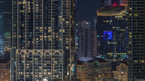 Aerial Nighttime Cityscape with Illuminated Architecture of Dubai Downtown Timelapse United Arab