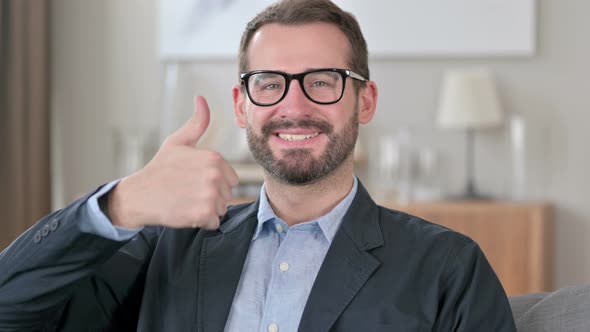 Portrait of Positive Young Businessman Doing Thumbs Up