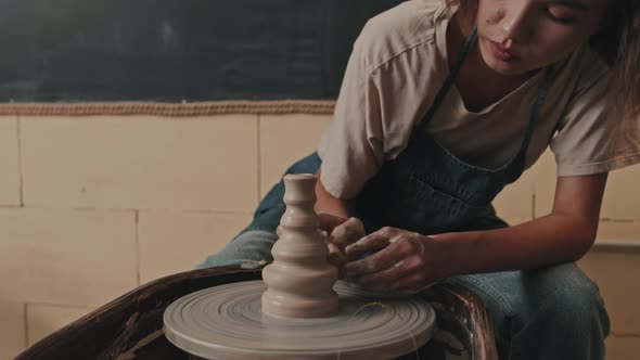 Woman Making Quirky Vase on Pottery Wheel