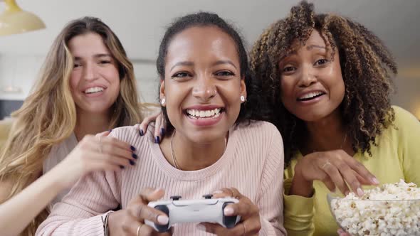 Competition Multiracial Young Girl Friends Play Video Games Together at Home