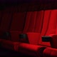 Red velvet movie theatre cinema seat chairs with dolly tracking shot - VideoHive Item for Sale