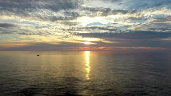 Sunset Over the Sea Flew Away on a Drone in the Sun