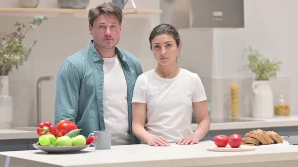 Mixed Race Couple Showing No Sign in Kitchen Head Shake