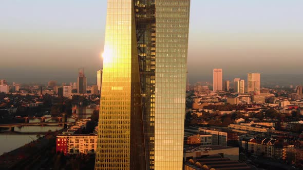 Frankfurt ECB Skyline Aerial Shot at early sunrise reflecting sun