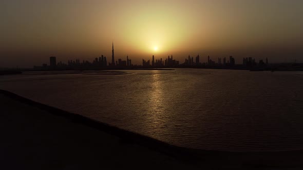 Aerial view of Dubai skyscrapers at sunset, UAE.