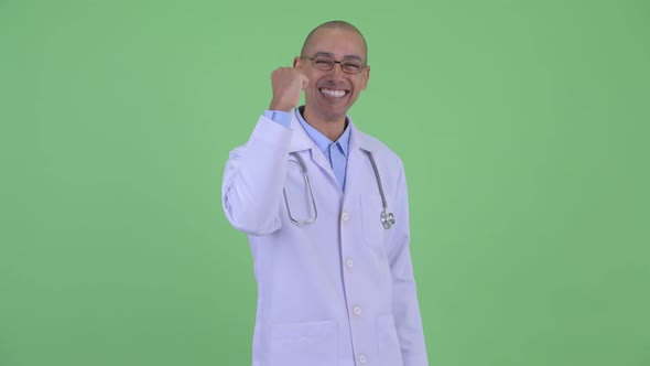 Happy Bald Multi Ethnic Man Doctor Getting Good News