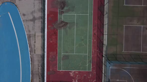 An aerial view of an old abandoned basket ball field. Lost sports complex.