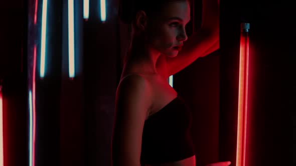 Sensual Woman Under Neon Illumination