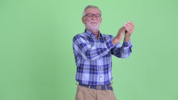 Happy Senior Bearded Hipster Man Clapping Hands