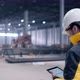 Follow footage of employees male warehouse worker engineer in hard hat working. walking  - VideoHive Item for Sale