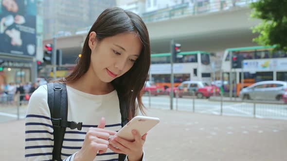 Woman use of mobile phone at street