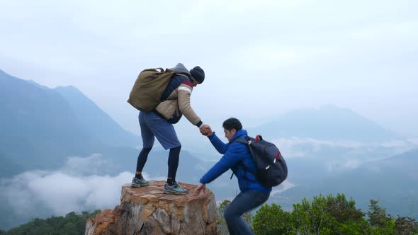 Helping Hand Between Two Hikers