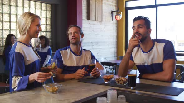 Friends at the bar in a pub during the day