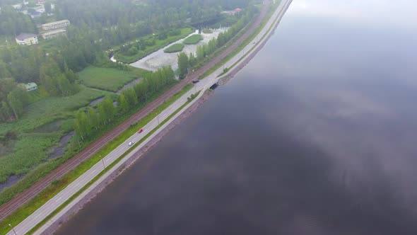Drone footage of a beach boulevard and railroad in a small Finnish town. Tranquil place and calm wea