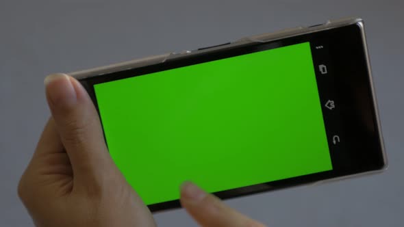 Mobile phone green screen  background 4K UHD 2160p footage - Smart phone using green screen 4K 3840X