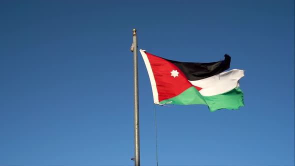 Jordan Flag Waving in the Wind Against Blue Sky