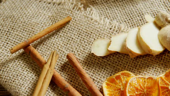 Cinnamon sticks with sliced ginger and lemon 4k